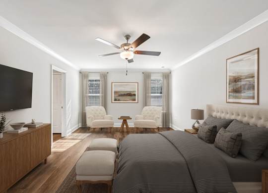 Primary Bedroom with king size bed and large window letting in nice natural light.