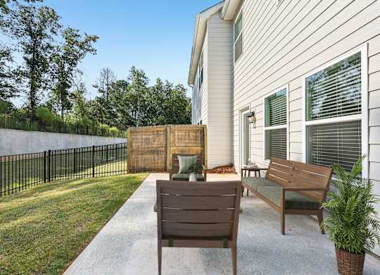 A private fenced patio offering an elegant outdoor retreat.