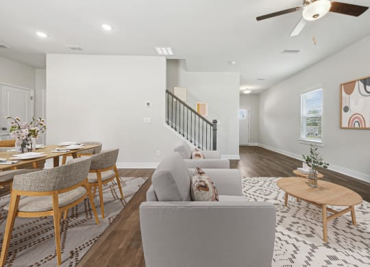 4-bedroom single family home with open-concept floor plans. The kitchen dining room is open to the living room with recessed lighting and ceiling fan.
