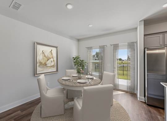 The intimate dining space elegantly set for four