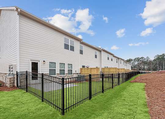 Back patio with fenced in yard.