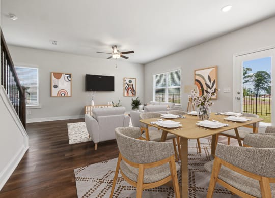 4-bedroom single family home with open-concept floor plans. The kitchen dining room is open to the living room with recessed lighting and ceiling fan.