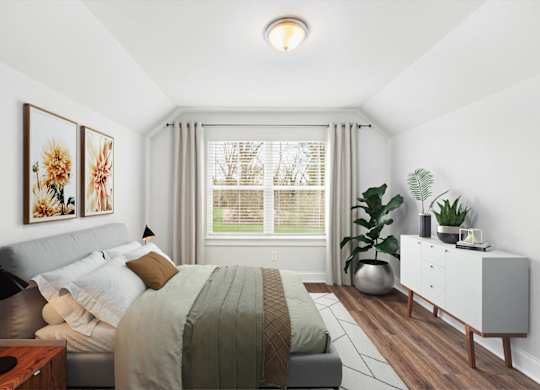 A bedroom with a bed, nightstand, and a plant.