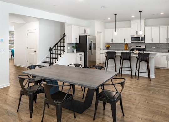 Spacious kitchen with an island, ample storage, and stainless steel appliances.