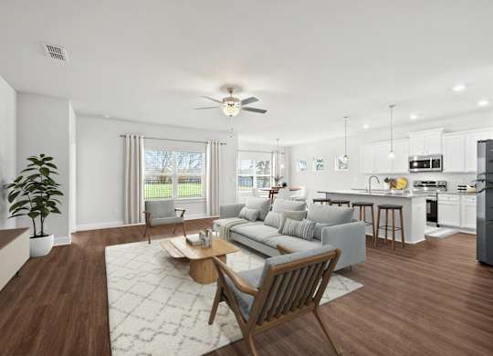 A modern living room with a grey sofa and wooden coffee table.