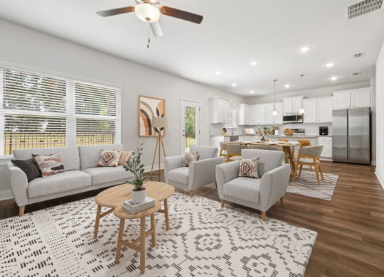 4-bedroom single family home with open-concept floor plans. The kitchen dining room is open to the living room with recessed lighting and ceiling fan.