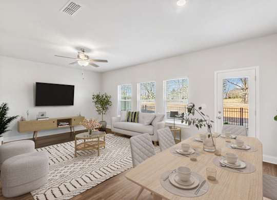 Living room with large window letting in a ton of natural light.