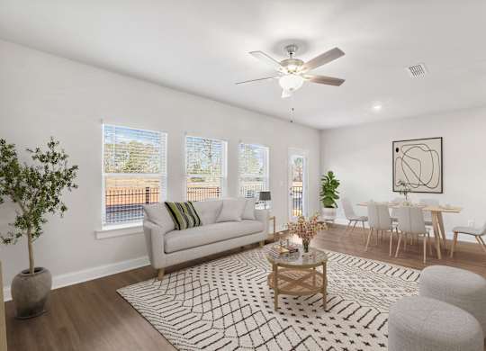 A view of the living room and intimate dining space