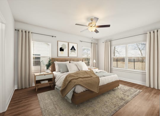 a bedroom with a bed and a ceiling fan