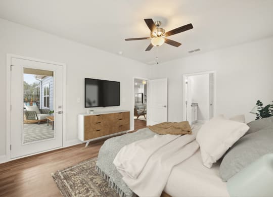 a bedroom with a large bed and a ceiling fan