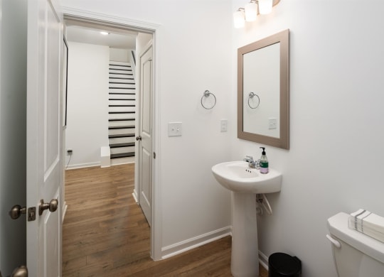 a small bathroom with a sink and a mirror