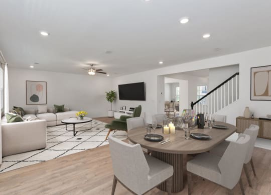 a living room and dining room with a table and chairs