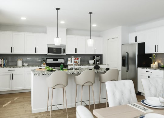 an open kitchen and dining area with white cabinets and stainless steel appliances