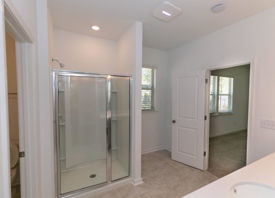 a bathroom with a shower and a sink