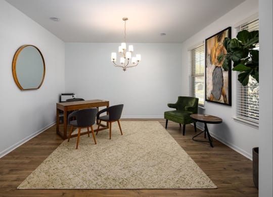 a dining room with a table and chairs and a chandelier