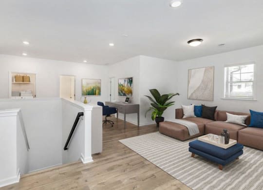 a white living room with a couch and a table