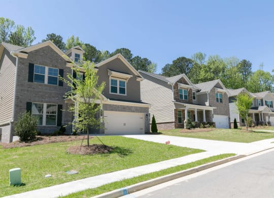 a row of houses on the side of a street