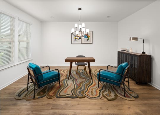 a dining room with blue chairs and a table