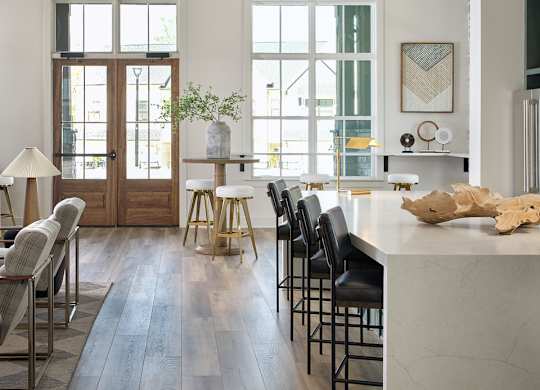 Inviting clubhouse space bathed in natural light with modern seating throughout.