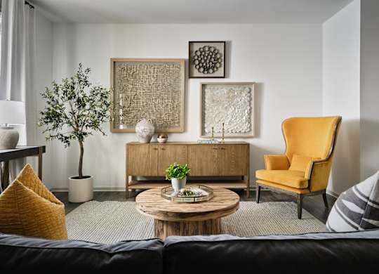 Living room with large window letting in a ton of natural light.