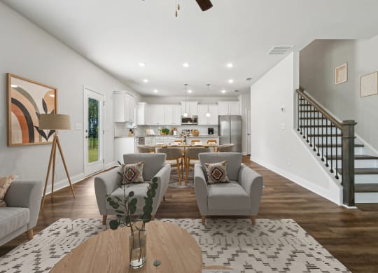 4-bedroom single family home with open-concept floor plans. The kitchen dining room is open to the living room with recessed lighting and ceiling fan.