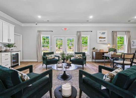 a living room with couches and chairs and a dining room with a table