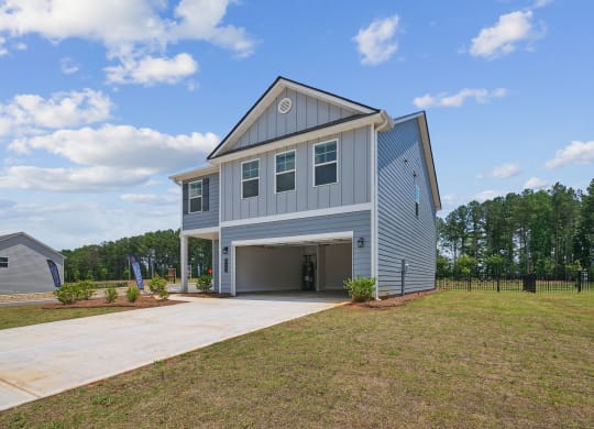 4-bedroom single family home rental - attached 2 car garage and fenced in backyard.