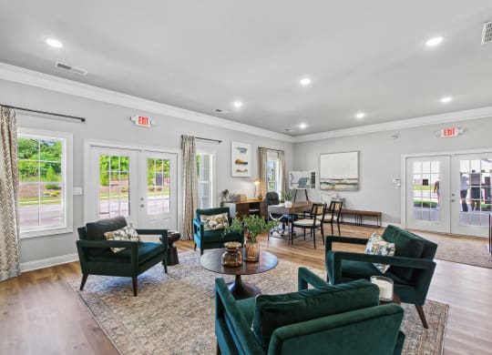 a living room with couches and chairs and a table