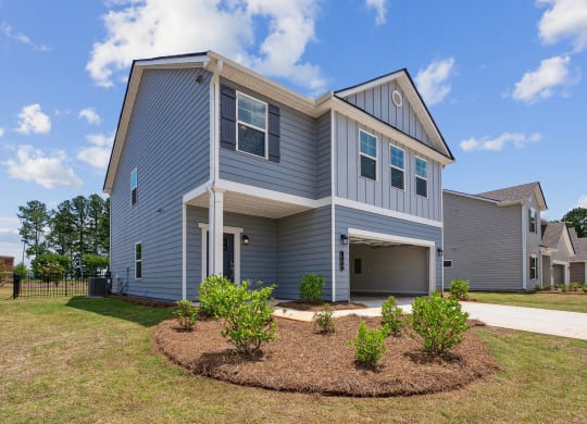 4-bedroom single family home rental - attached 2 car garage and fenced in backyard.