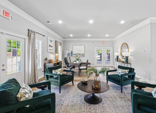 a living room with couches and chairs and a table