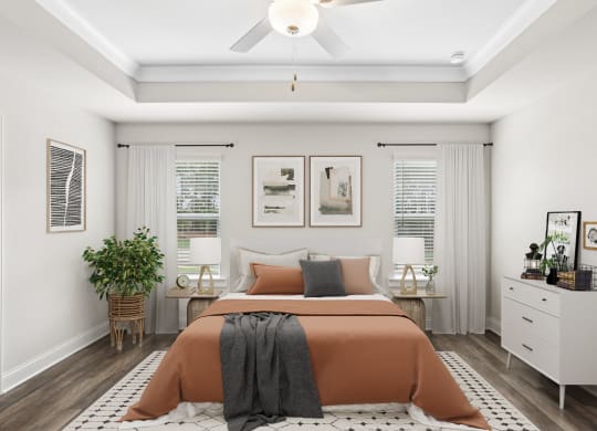 a bedroom with a bed and a ceiling fan