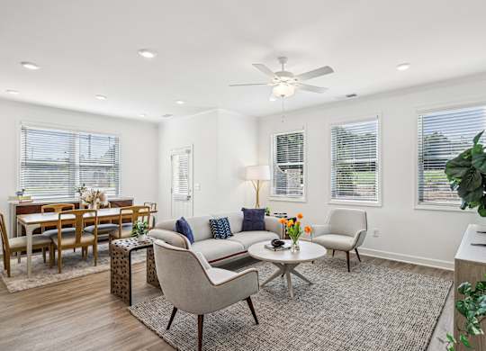 a living room with a couch and chairs