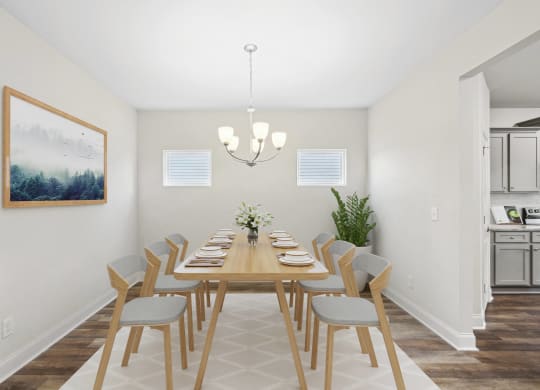a dining room with a long wooden table and chairs