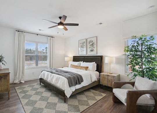 Spacious and calming primary suite with refined décor, a king bed, and nature-inspired accents.