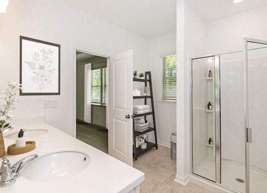 Bathroom with double vanity, and walk-in shower.