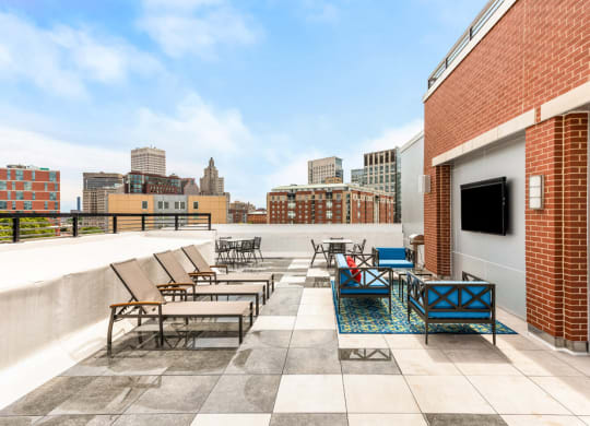 rooftop of station row with sun chairs and tv