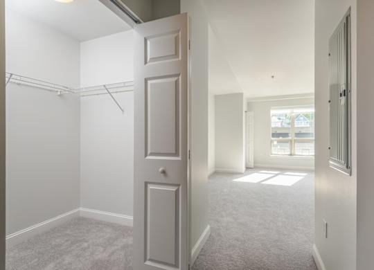 View of the first bedroom with oversized closets in Munroe Place in Quincy, MA