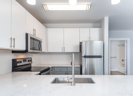 Munroe place apartment with high quality finishes in the kitchen and stainless steel appliances