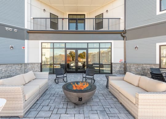 Outside seating with fire pit at Millside