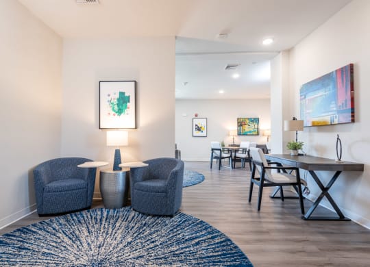 Resident lounge with tablet chairs at Millside in Canton