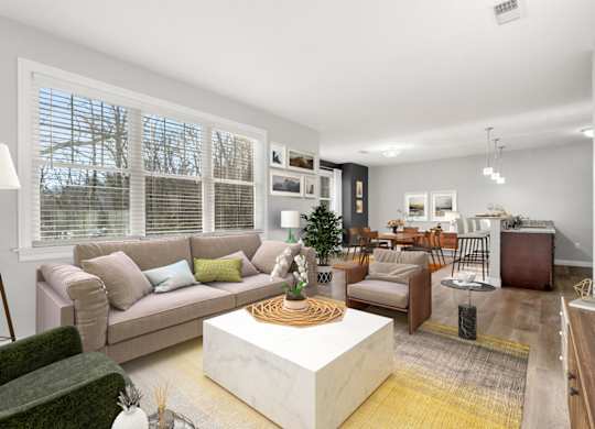 Virtually staged Ashland woods apartments living room, extra large floor plans and woods outside your window