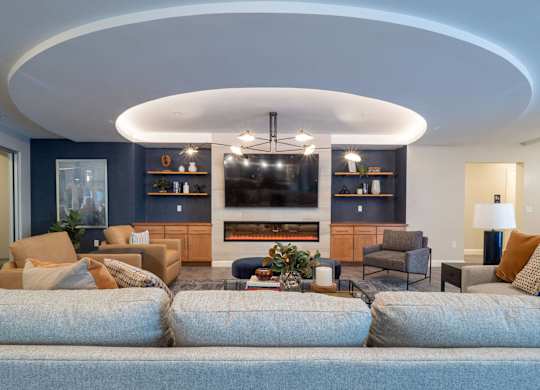 A spacious community room with a mix of modern and comfortable seating.