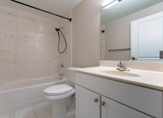 a bathroom with a sink toilet and a bath tub