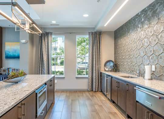a kitchen with a large counter top and a window