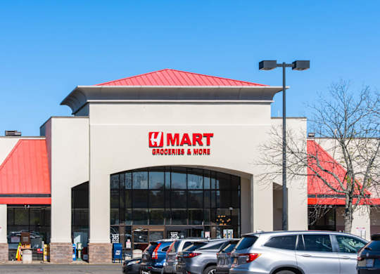 A large store with a red roof and a sign that says