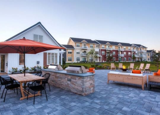 Redbrook plymouth leasing center, apartments, grills and firepits.