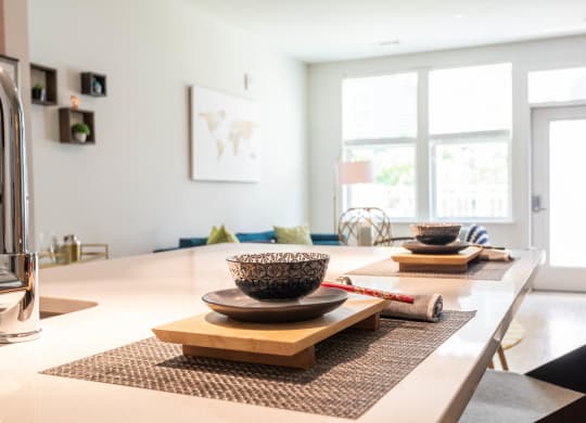 a view of the dining room and living room from the kitchen