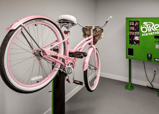 a bike parked on top of a black pole