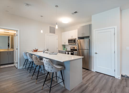Millside kitchen granite countertops stainless appliances oven range microwave bright finishes