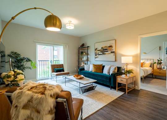 Another living room setup with natural tones, a floor lamp, and decor that seamlessly blends luxury and comfort.